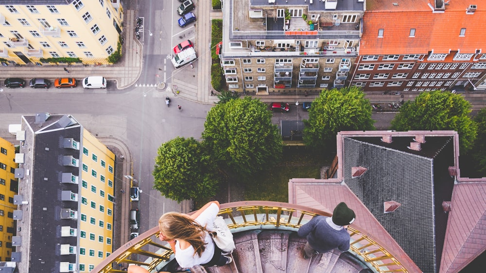 two person standing on stairs in building