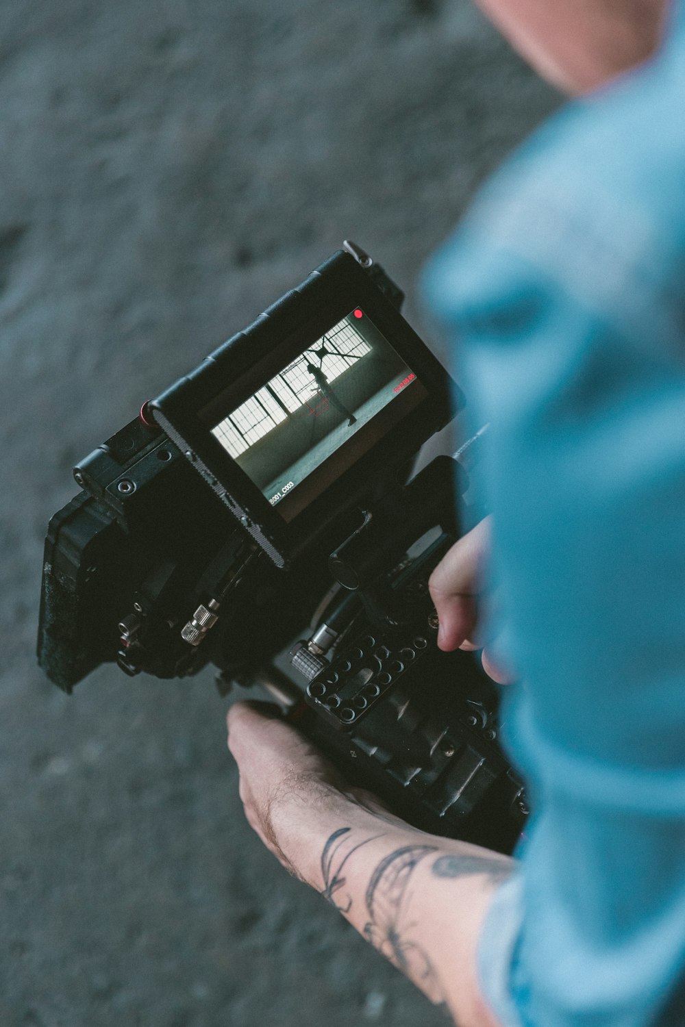 person holding black DSLR camera