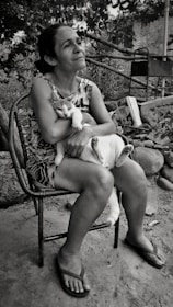 Natural setting with an osteopath consulting with a cat owner outdoors