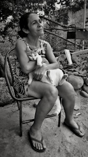 Natural setting with an osteopath consulting with a cat owner outdoors