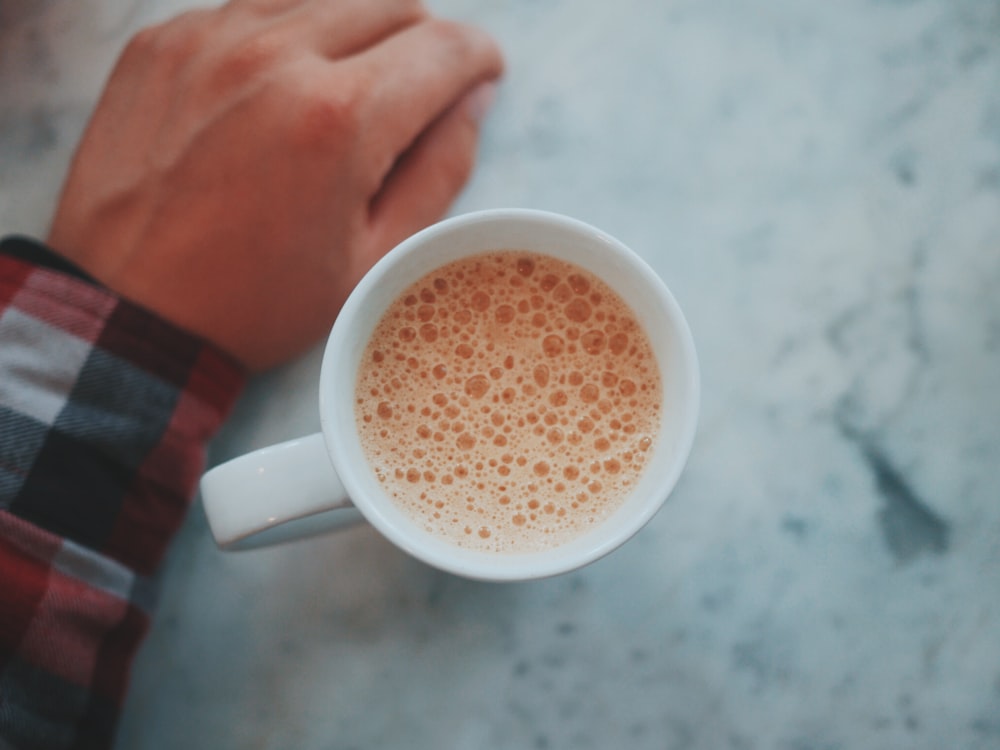 mug with coffee in shallow focus