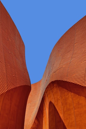 minimalist photography of brown wavy structure