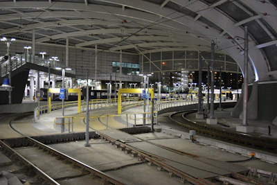 Detailed technical drawings of tram-train stations and tracks.