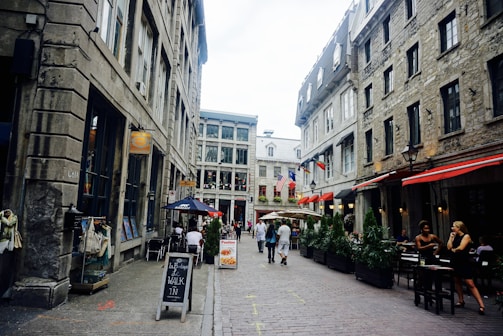 A charming European cobblestone street lined with boutique shops and cafes.