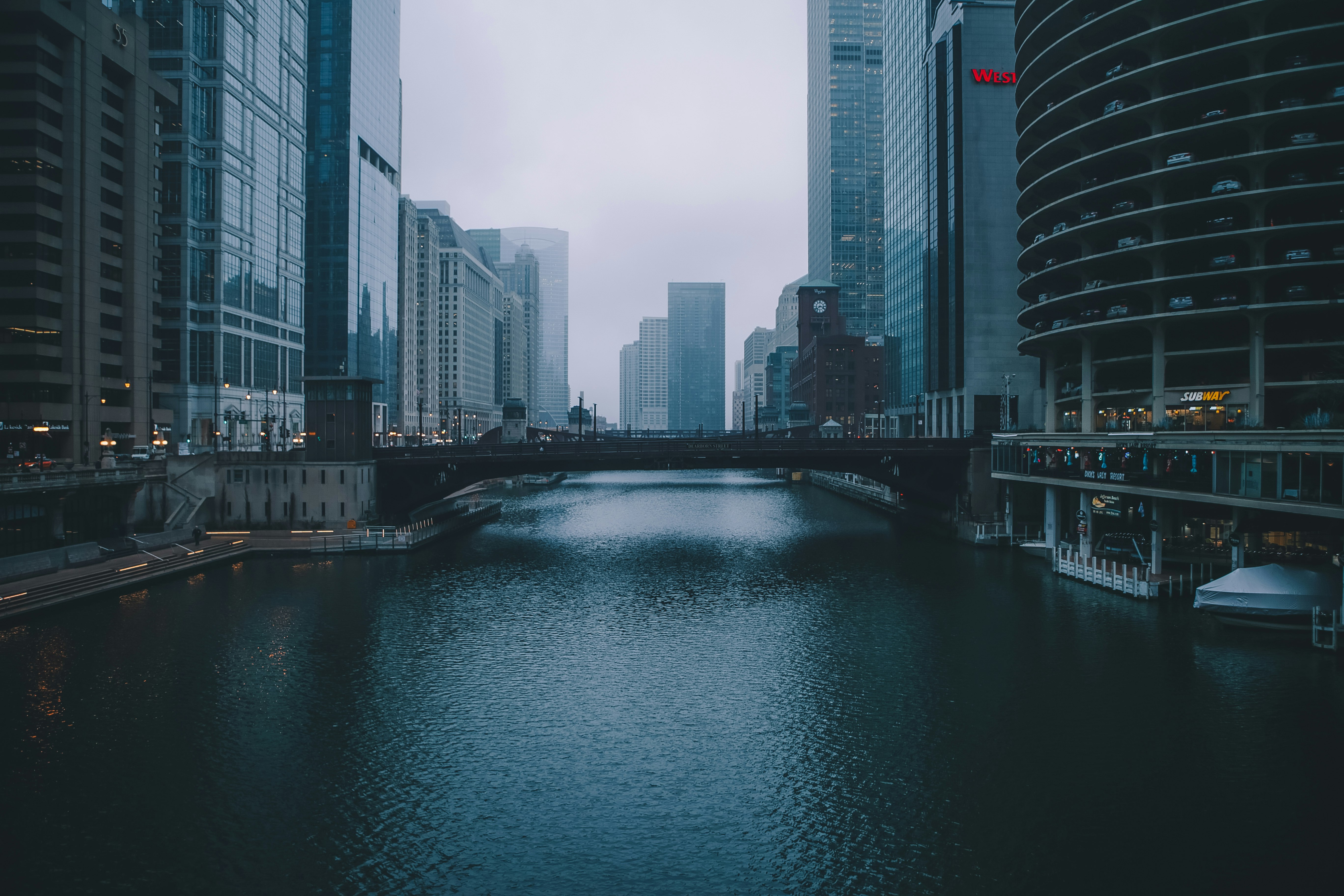 bridge between commercial buildings during daytime