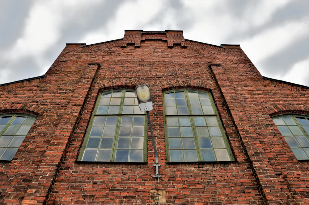 low angle photography of brown painted building