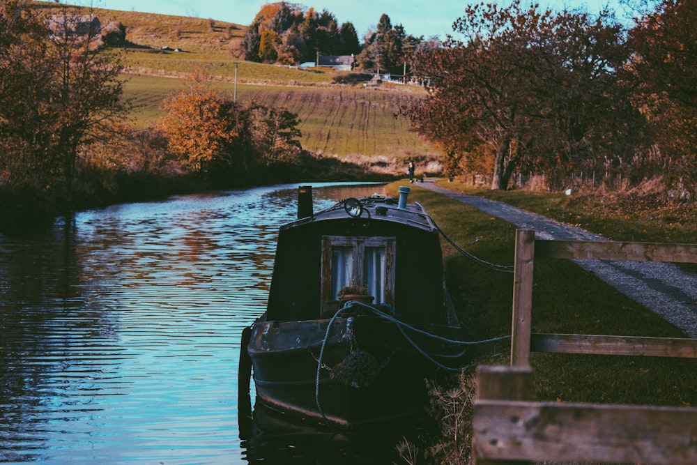 black boat on body of water