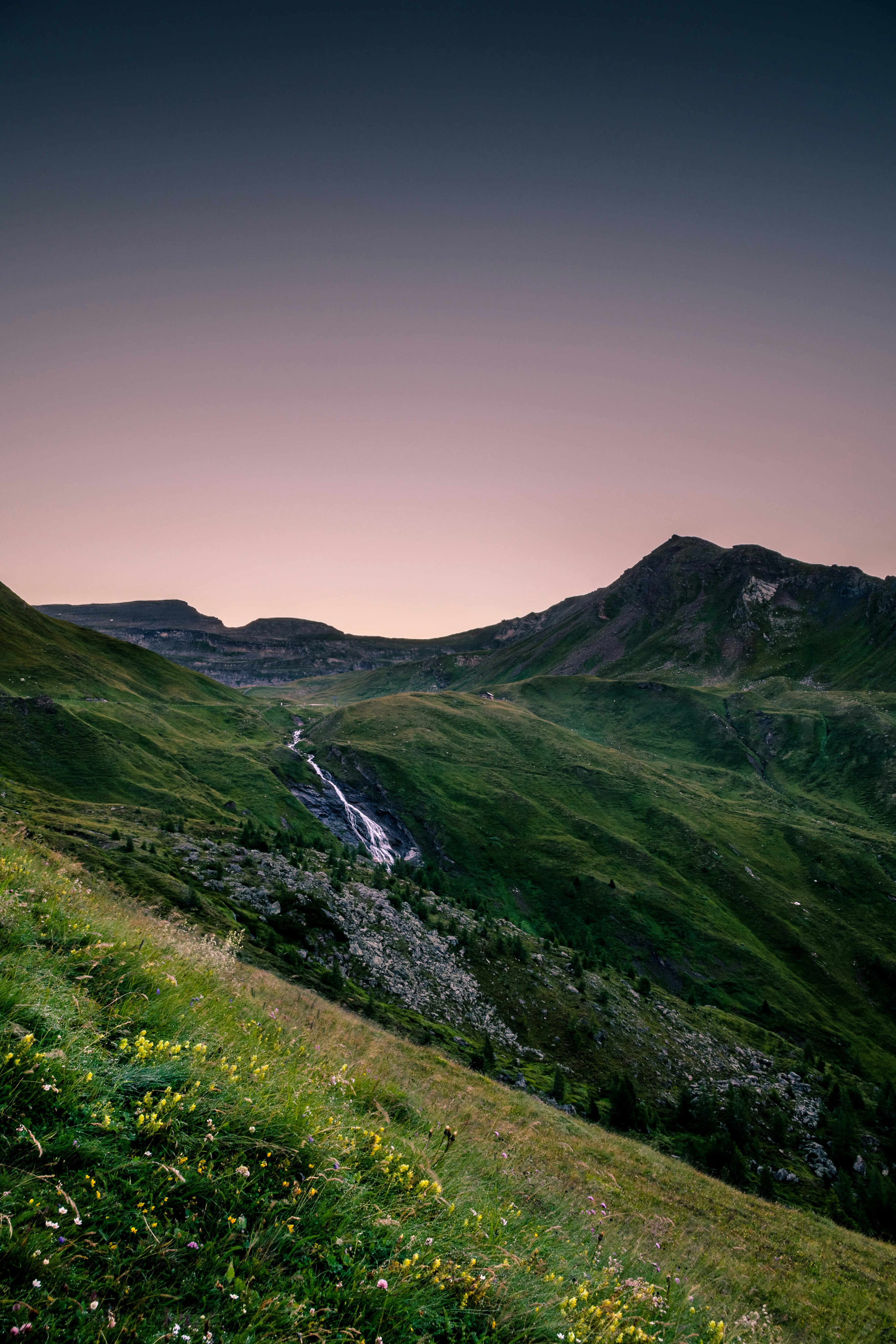 landscape photography of mountain range with river cascading