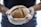 A satisfied customer holding a loaf of Psychevals sweet bread.