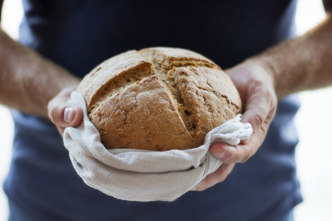 person holding pastry, I took this photo on the fly and made my husband hold the bread. There’s something about this pic