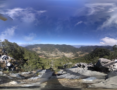 A panoramic view of Trabzon’s lush green mountains and the Black Sea coastline on a bright day.