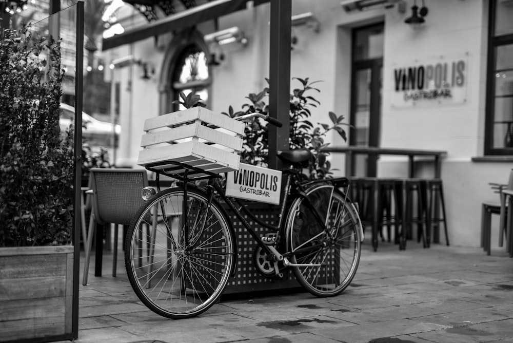 grayscale photo of a city bicycle