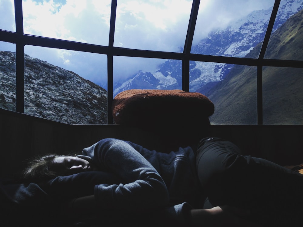 person sleeping near window