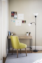 A minimalist workspace with a light gray desk, a sleek lamp, and a few carefully chosen decor pieces in soft hues.