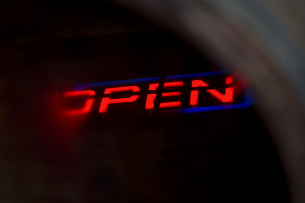 red open neon light signage
