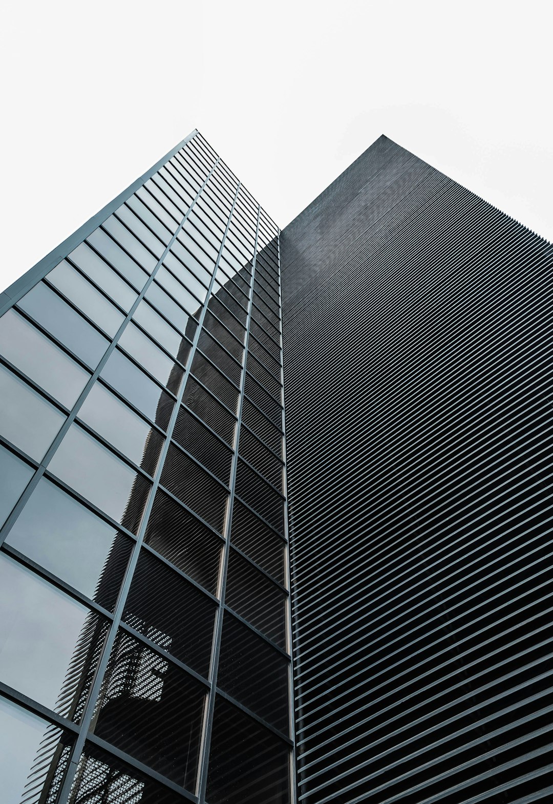 low angle photography of black glass building