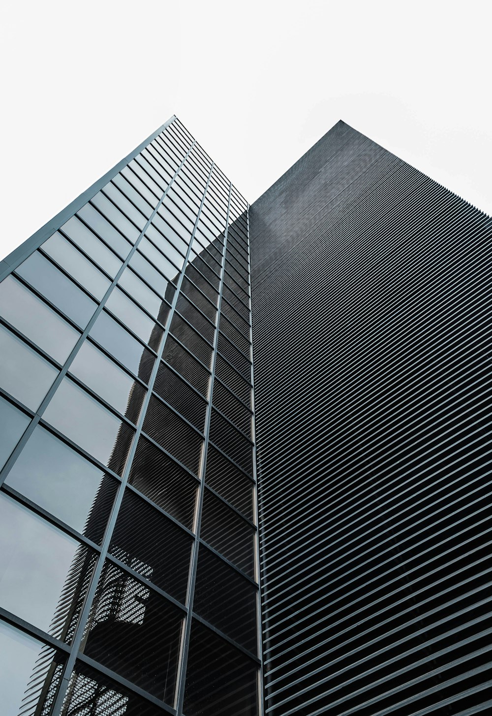 low angle photography of black glass building