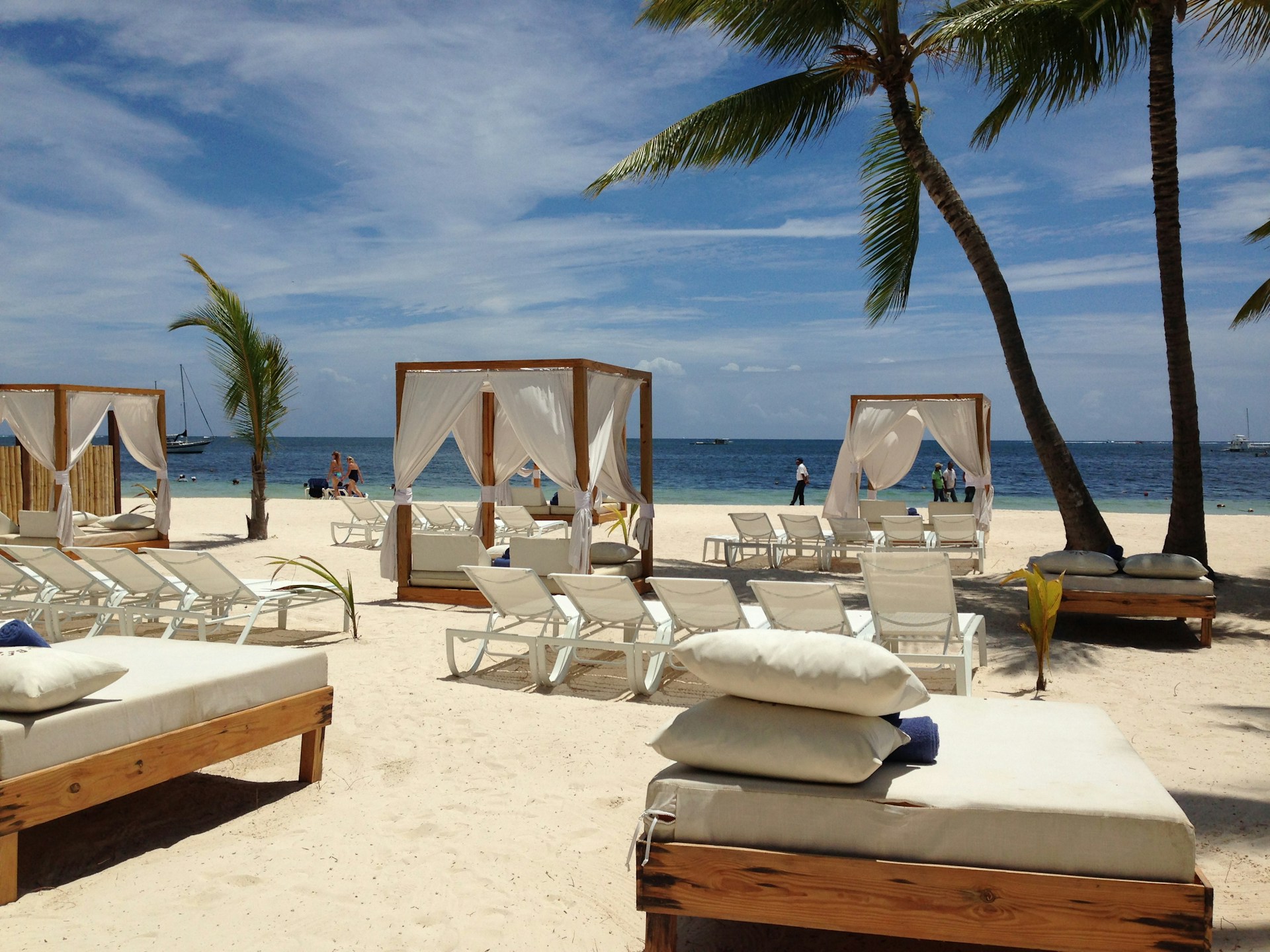 woman wearing yellow long-sleeved dress under white clouds and blue sky during daytime