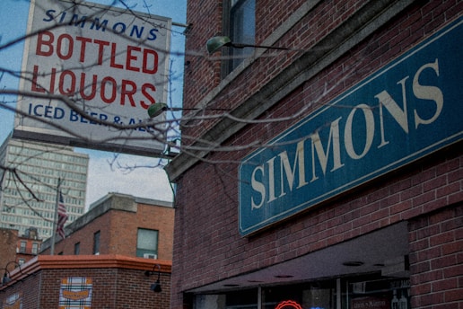 A vintage-style brewery storefront on Valtakatu street in Kemi, with a soft drink factory sign and a glimpse of Lapland's snowy landscape.