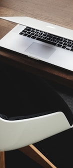 Apple MacBook beside computer mouse on table