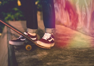 person standing beside skateboard