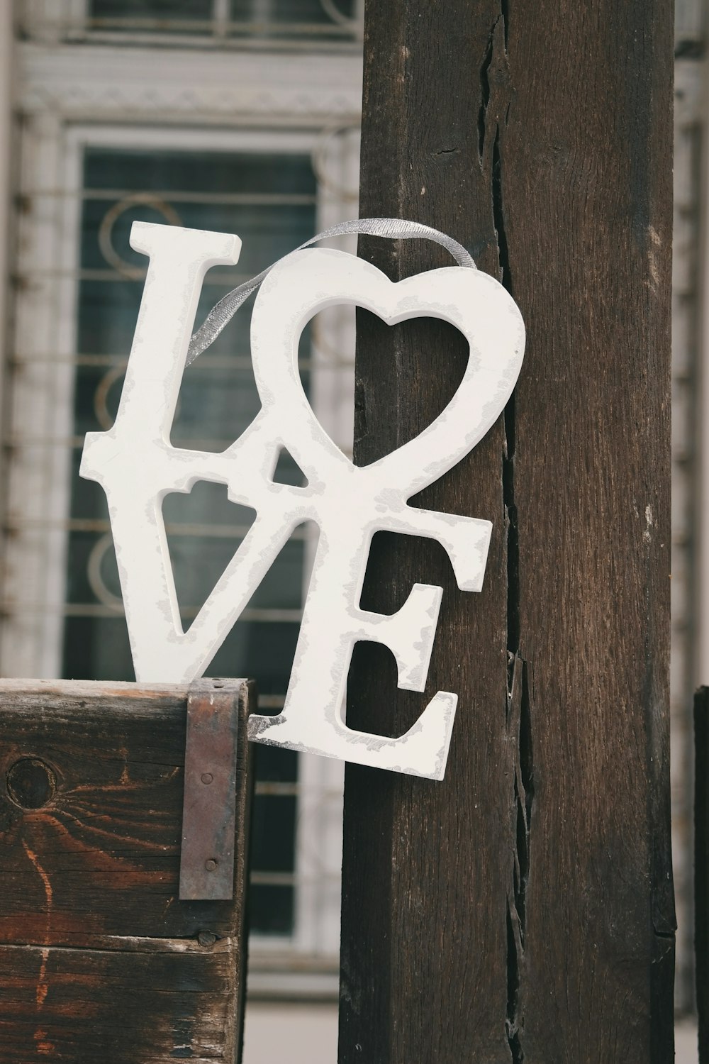 A white sign that says "LOVE."