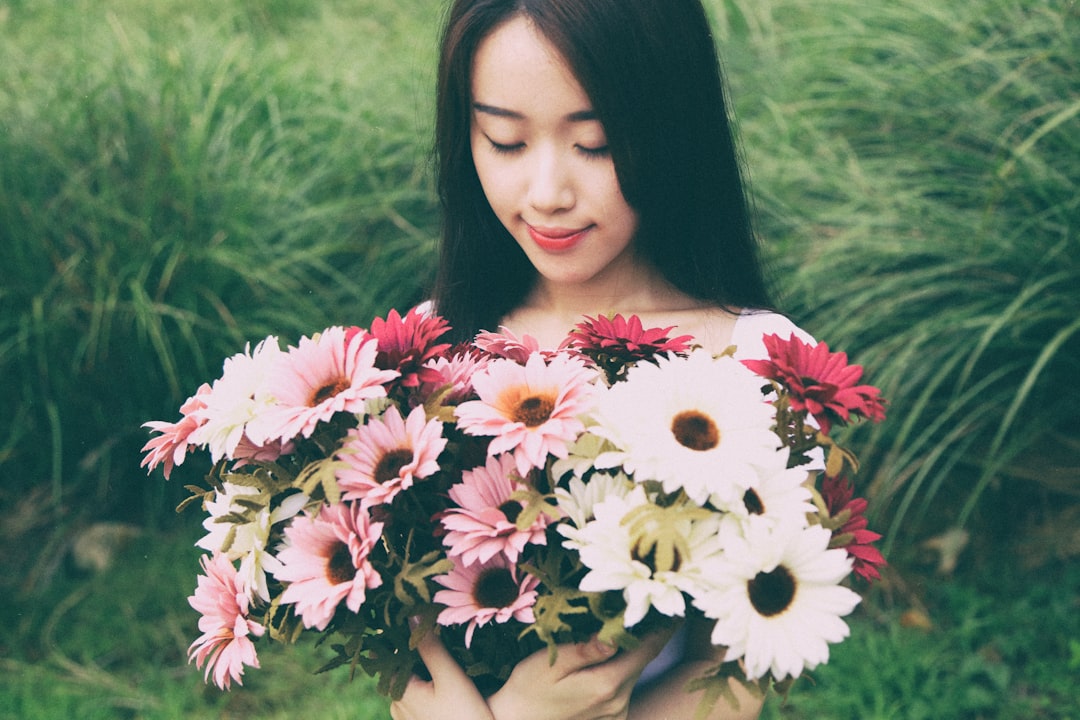 woman holding flowers