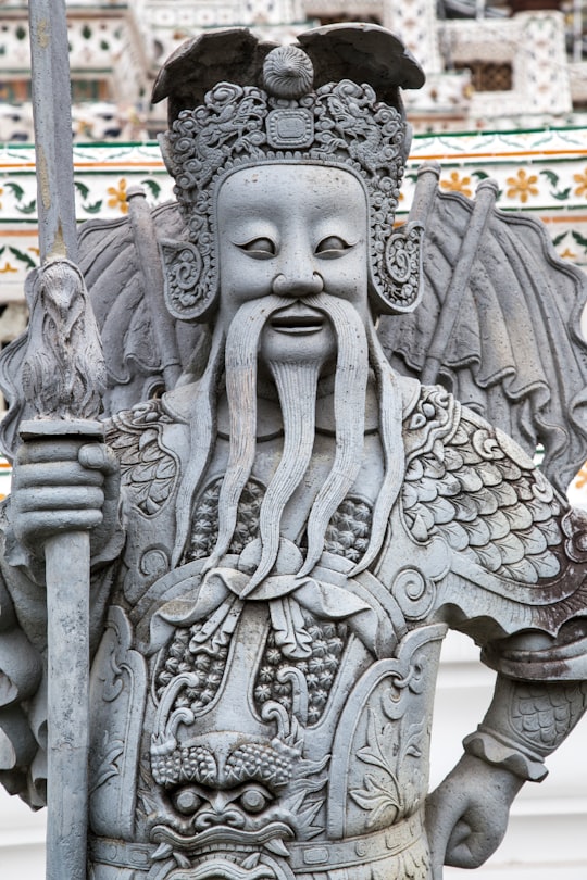 grey concrete statue during daytime in Wat Arun Thailand