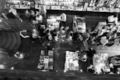 Community event inside the bookstore with people engaging in cultural discussions.
