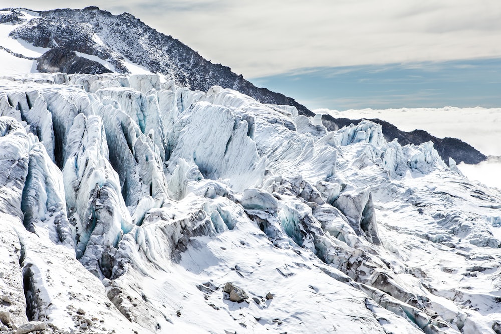 mountain covered with snow at daytime