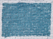 A freshly painted exterior brick wall showcasing a smooth, bold color finish.