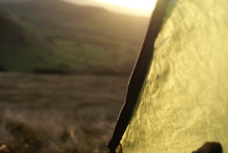 Close-up of waterproof oxford fabric and reinforced poles on a camping tent.