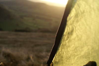 Close-up of waterproof oxford fabric and reinforced poles on a camping tent.