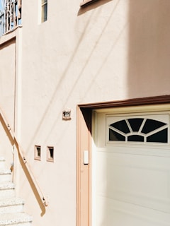 Before and after comparison of a commercial exterior transformed by our precise stucco work.