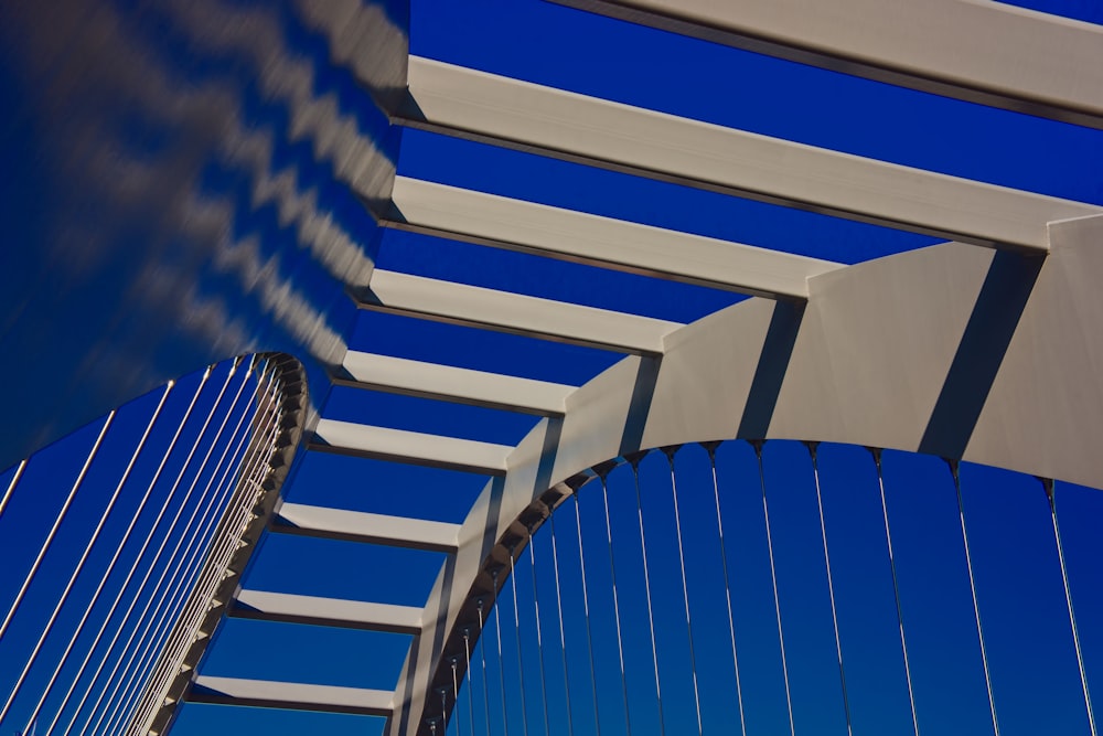 a close up of a bridge with a blue sky in the background