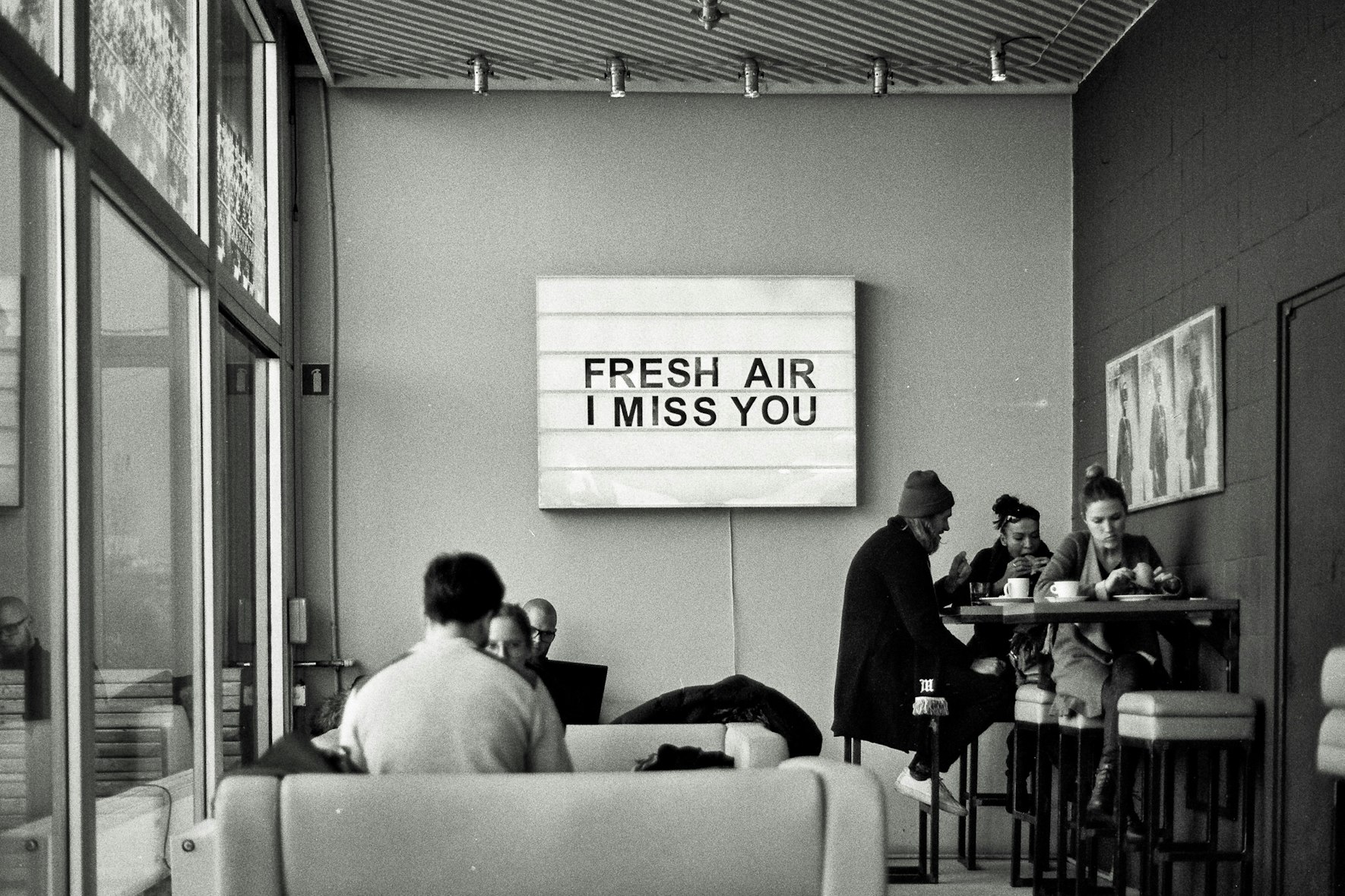 A cafe with a sign saying Fresh Air I Miss You