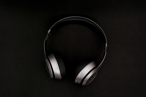 A sleek pair of yilans wireless bluetooth headphones showcased against a vibrant background.