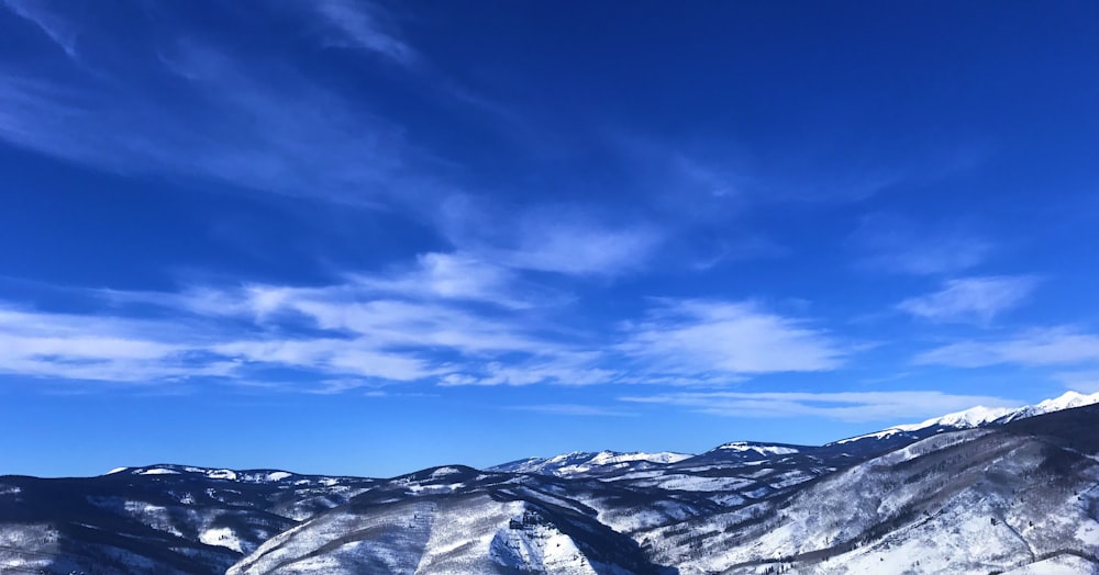 snow capped mountains under blue sky