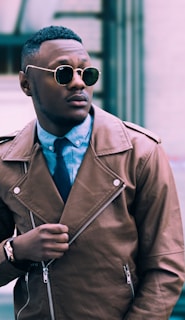 man in brown leather coat