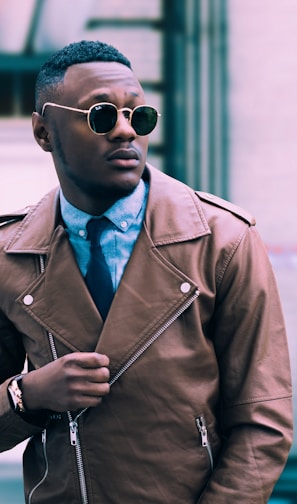 man in brown leather coat