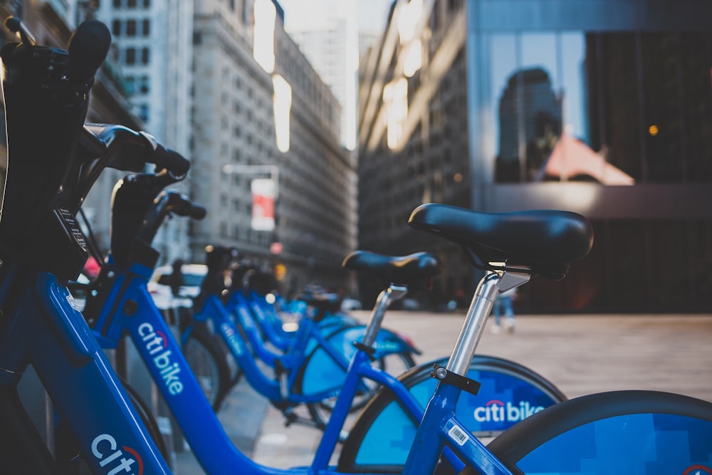 blue Citi Bike bicycles parked on sidewalk