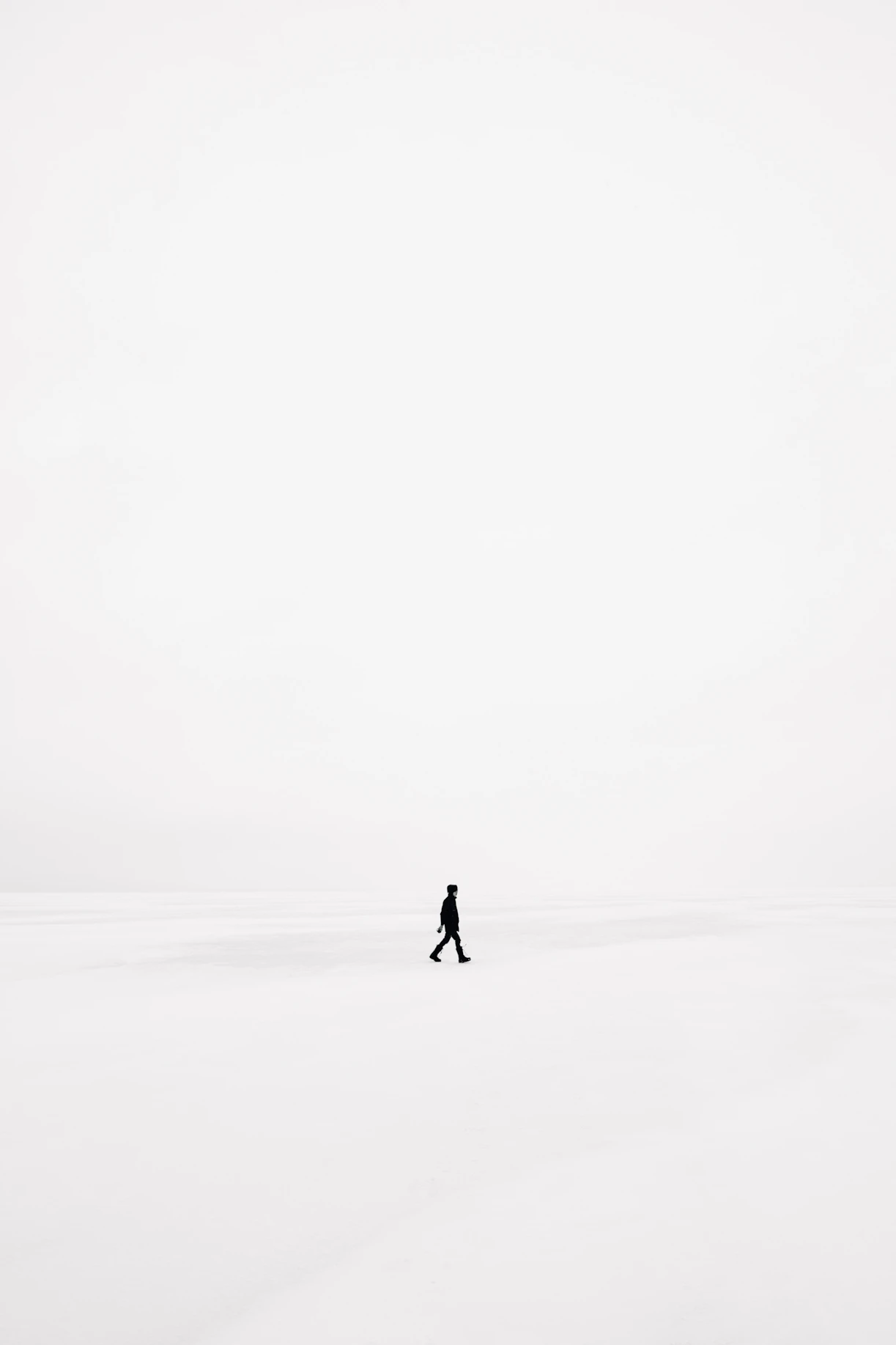 person walking on snowfield