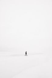 person walking on snowfield