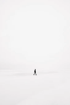 person walking on snowfield