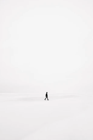 person walking on snowfield