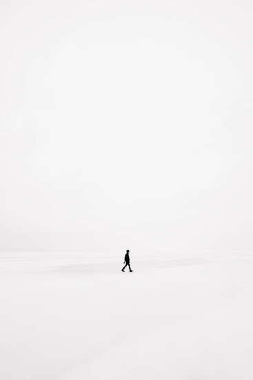 person walking on snowfield