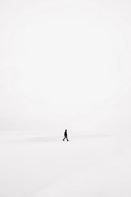 person walking on snowfield