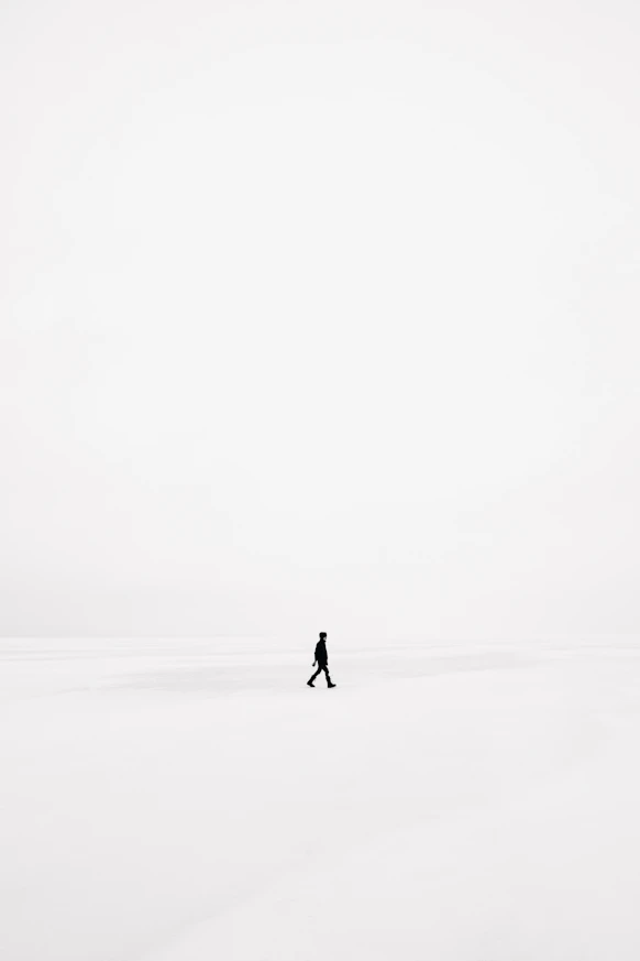 person walking on snowfield