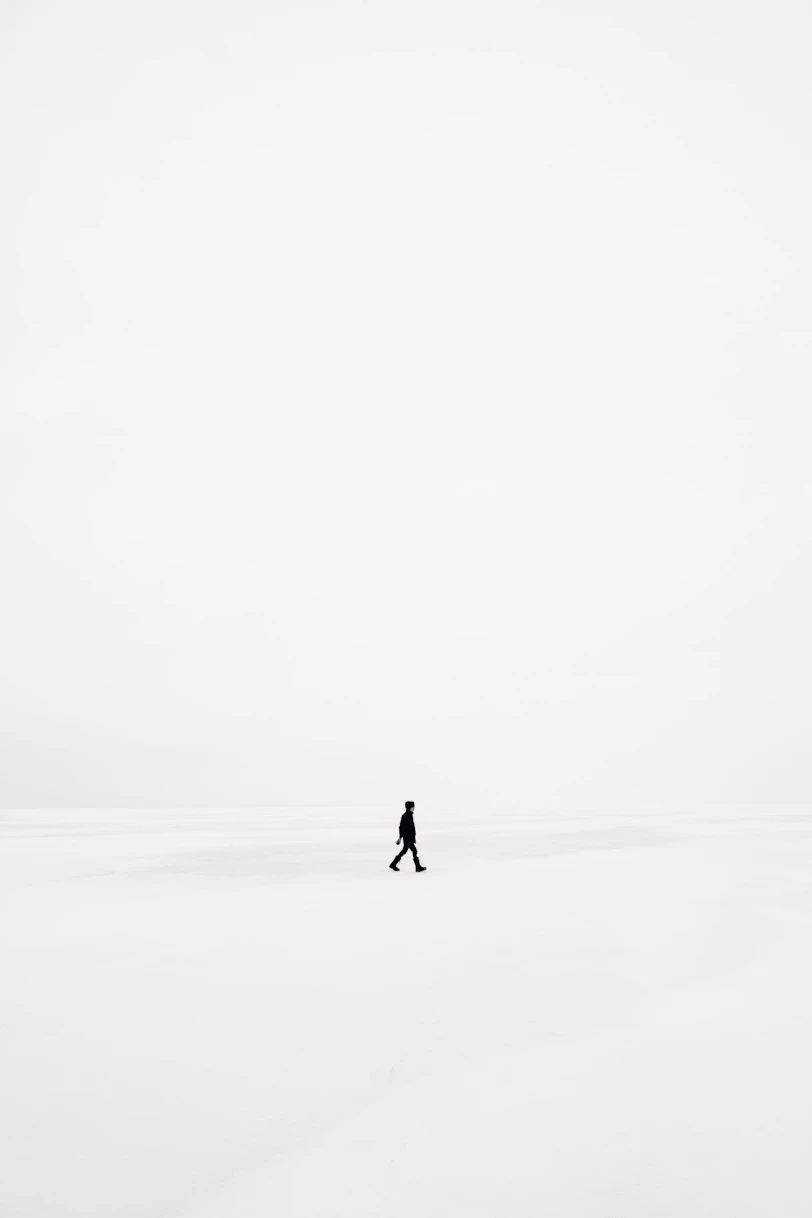 person walking on snowfield