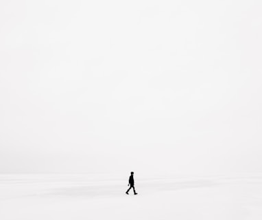 person walking on snowfield